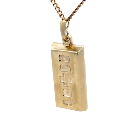 9ct yellow gold ingot pendant with Reeves and Sons branding, 34.2g, showcasing a polished gold ingot design.