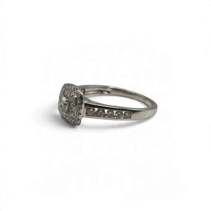 18ct white gold diamond cluster ring with sparkling diamonds, featuring a classic design by Reeves and Sons.