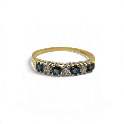 18ct yellow gold sapphire and diamond half eternity ring by Reeves and Sons, showcasing a band with alternating sapphires and diamonds.