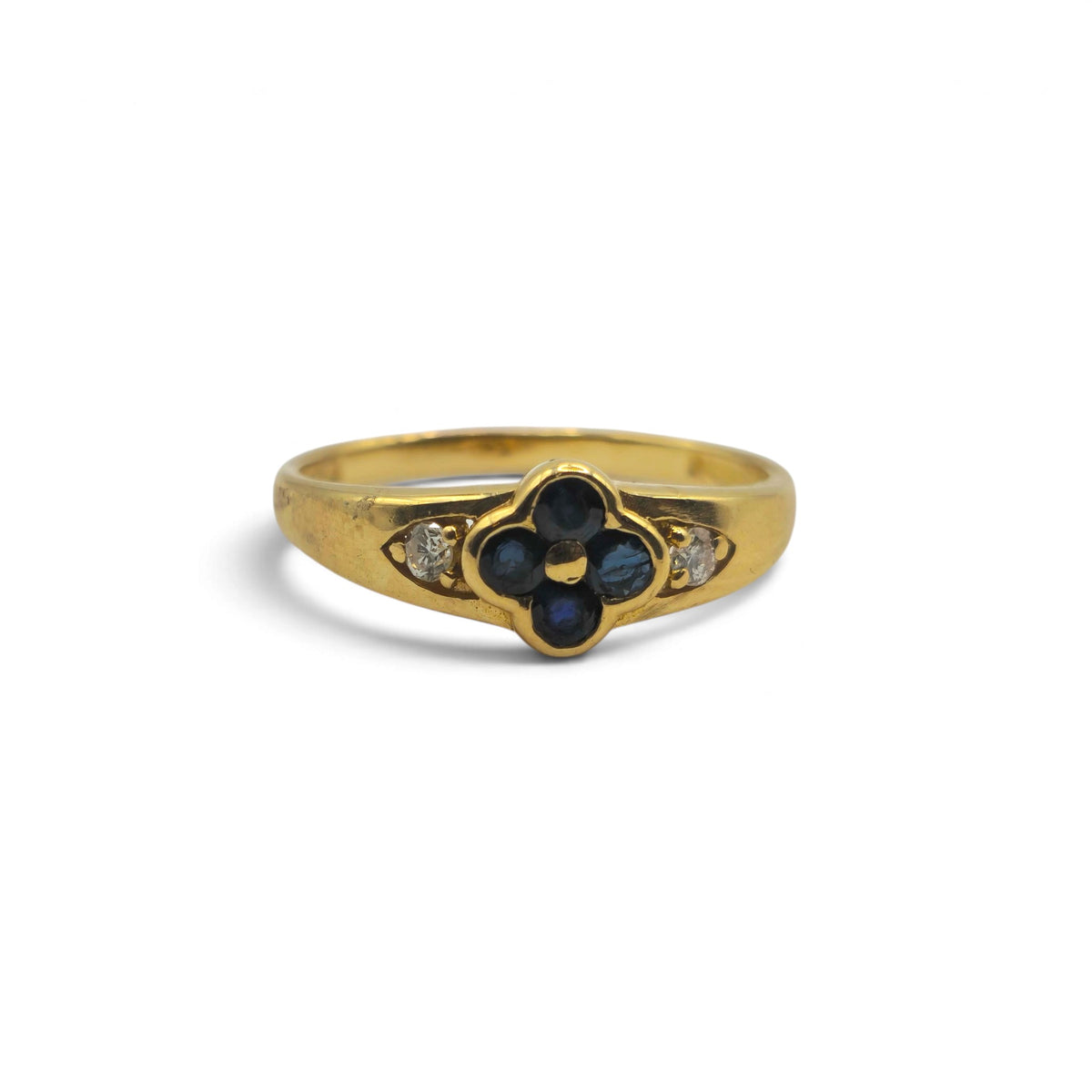 18ct yellow gold sapphire and diamond ring by Reeves and Sons, featuring a central sapphire and diamond accents