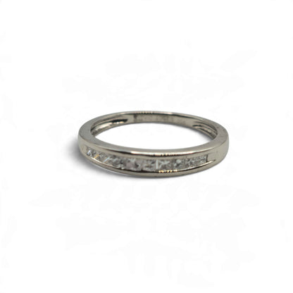 Platinum diamond half eternity ring by Reeves and Sons, featuring diamonds set along the band