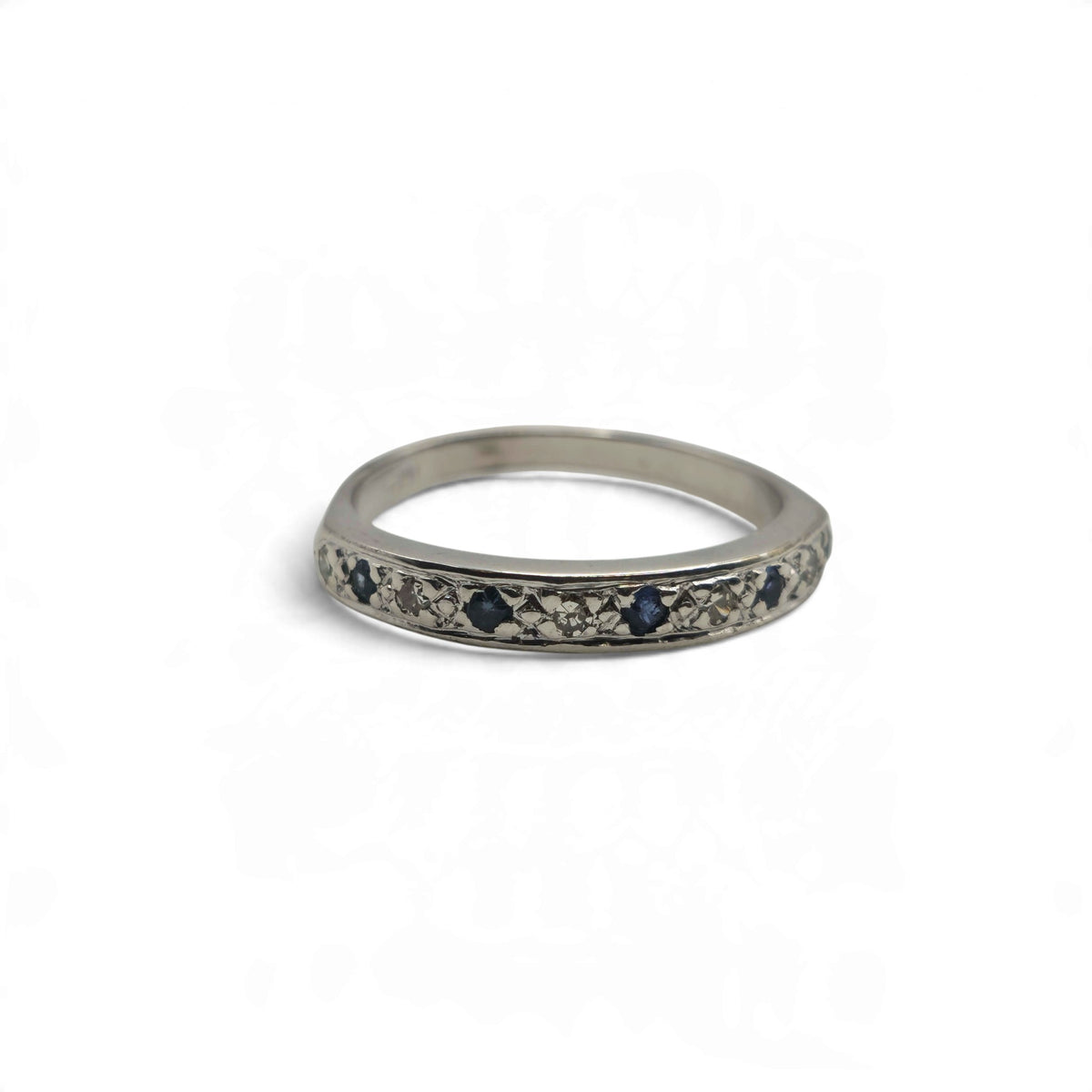 18ct white gold sapphire and diamond half eternity ring by Reeves and Sons
