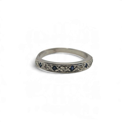 18ct white gold sapphire and diamond half eternity ring by Reeves and Sons