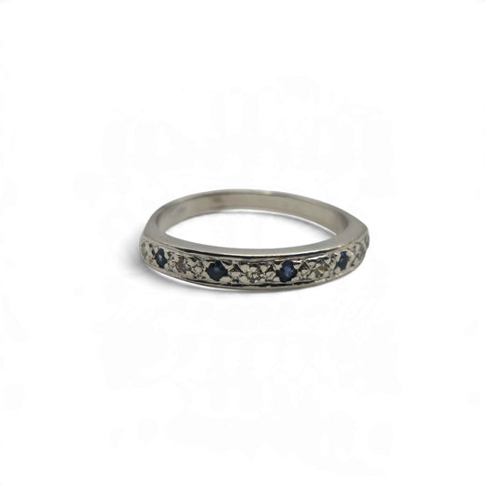 18ct white gold sapphire and diamond half eternity ring by Reeves and Sons