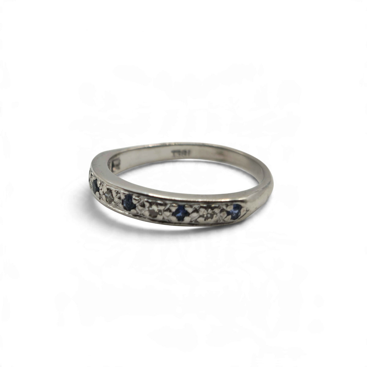 18ct white gold sapphire and diamond half eternity ring by Reeves and Sons