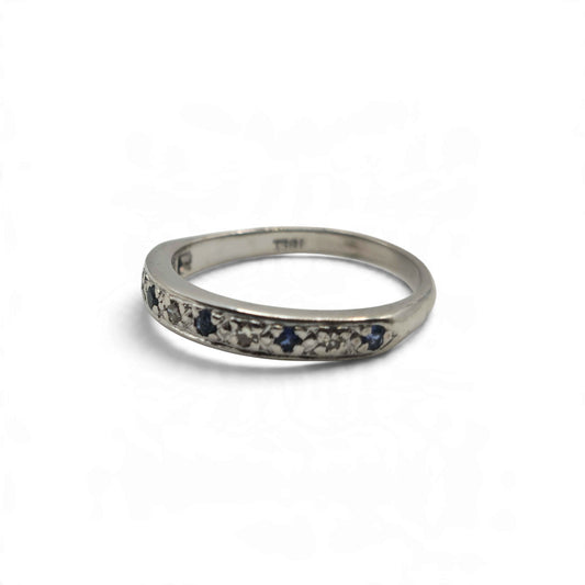 18ct white gold sapphire and diamond half eternity ring by Reeves and Sons