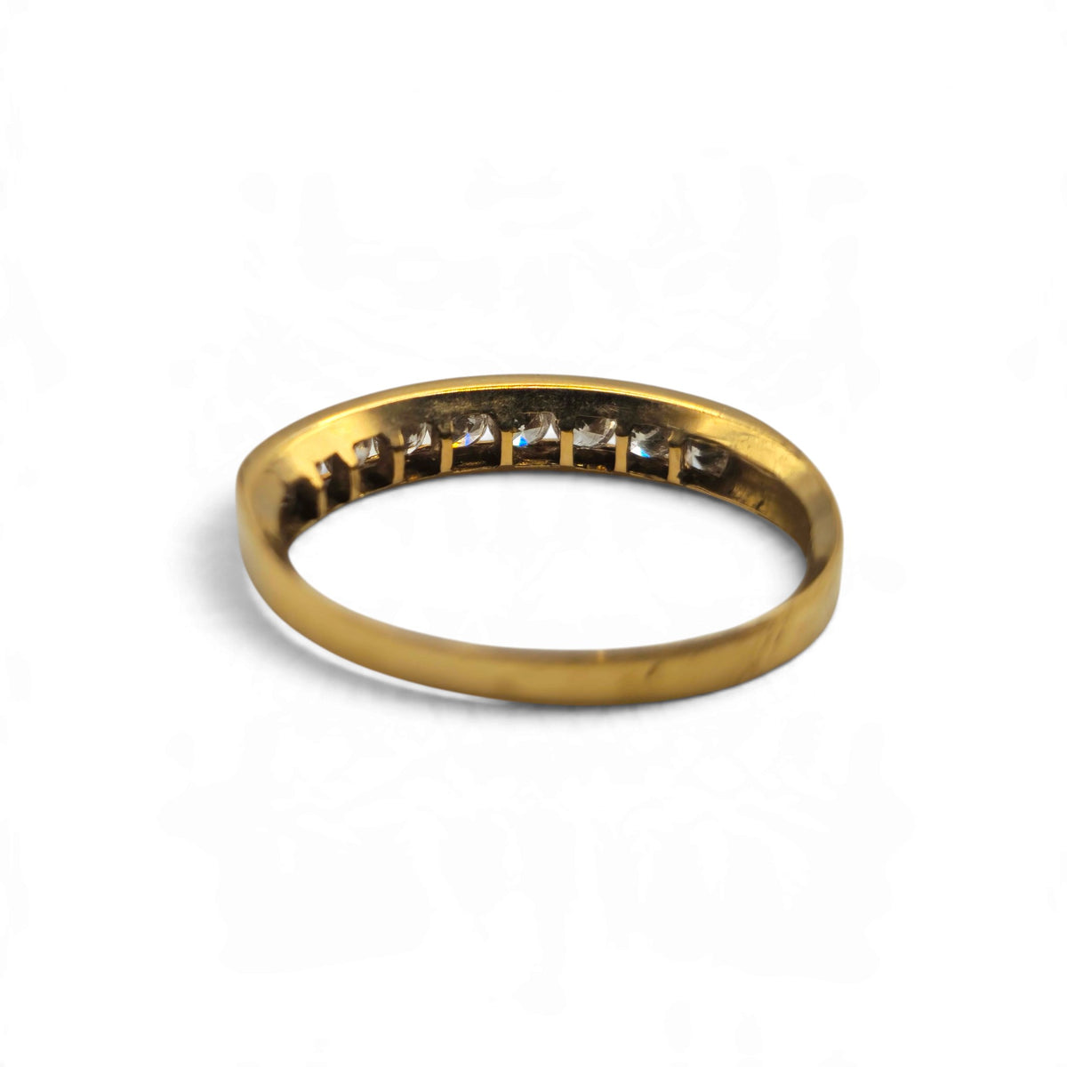 Reeves and Sons 18ct yellow gold half eternity ring with a classic band design
