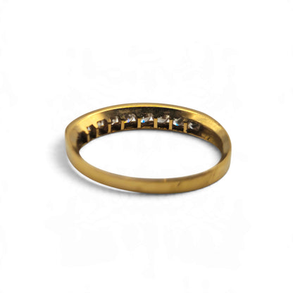Reeves and Sons 18ct yellow gold half eternity ring with a classic band design