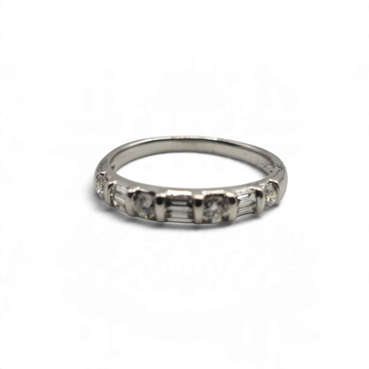 Reeves and Sons 18ct white gold half eternity ring with a classic band design
