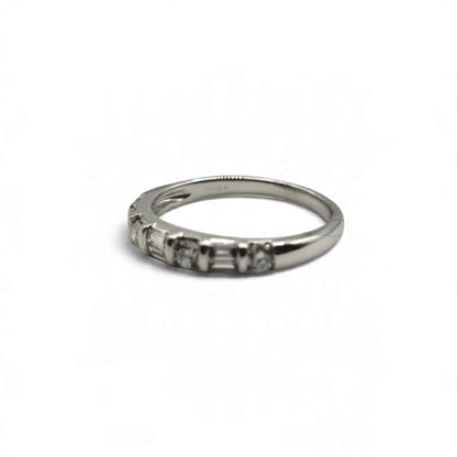 18ct white gold half eternity ring by Reeves and Sons, featuring a row of gemstones around the band