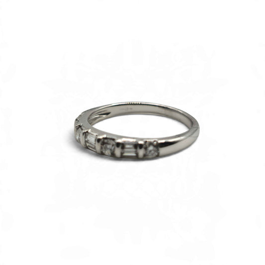 18ct white gold half eternity ring by Reeves and Sons, featuring a row of gemstones around the band