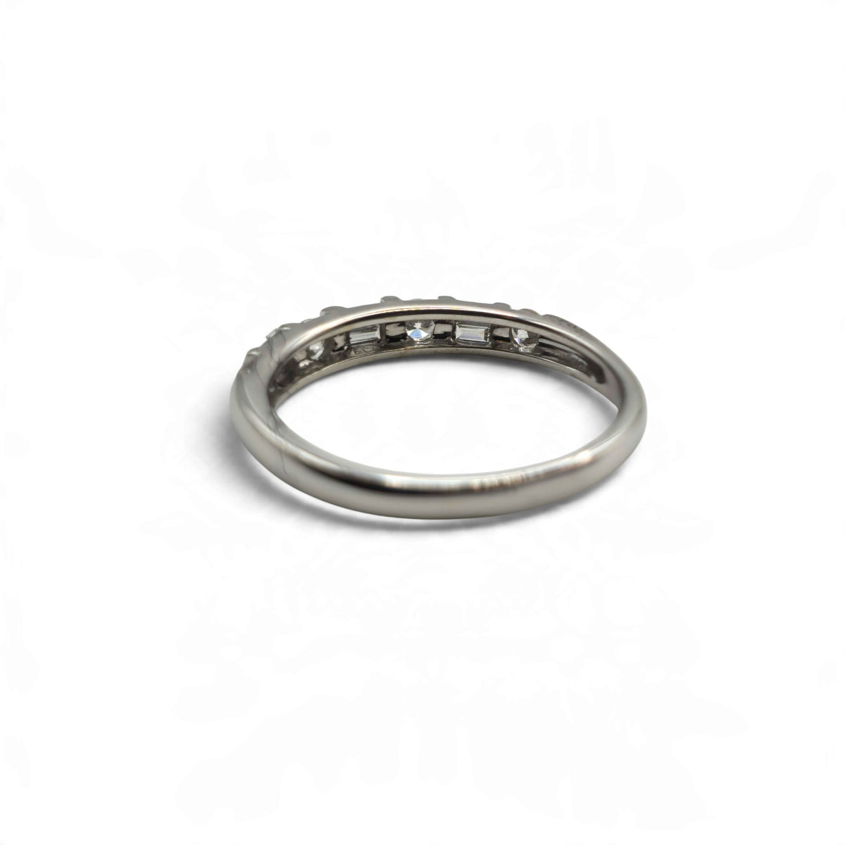 18ct white gold half eternity ring by Reeves and Sons, featuring a continuous row of gemstonesWinvalid