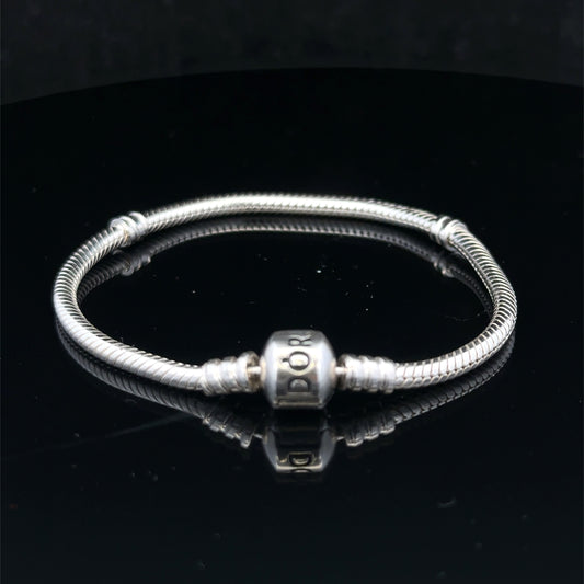 Silver Pandora bracelet by Reeves and Sons, 13.6g, featuring intricate links and a polished finish, displayed on a plain background.