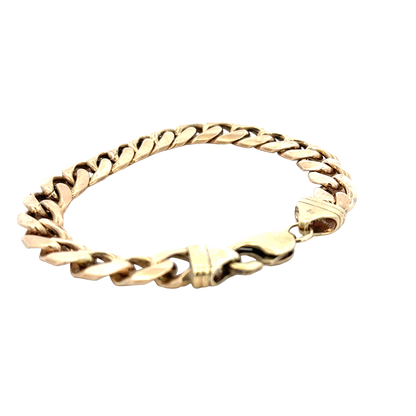 9ct yellow gold curb bracelet weighing 42.4g with a polished finish, crafted by Reeves and Sons.