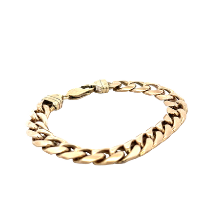 9ct yellow gold curb bracelet with a polished finish, showcasing its linked chain design and secure clasp.