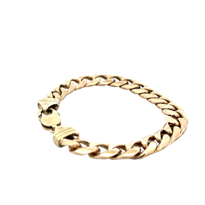 9ct yellow gold curb bracelet weighing 42.4g from Reeves and Sons, featuring interlinked gold curb chain links.