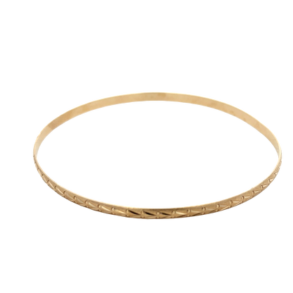 Reeves and Sons 9ct yellow gold bangle weighing 4.2g, stylish jewelry accessory with smooth polished finish.