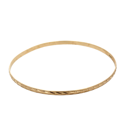 9ct yellow gold bangle by Reeves and Sons, sleek and polished jewelry piece, weight 4.2g with intricate design details visible.