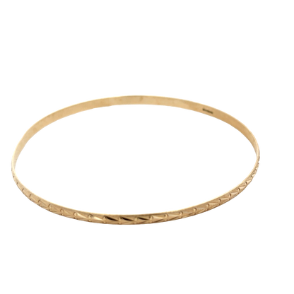 9ct yellow gold bangle by Reeves and Sons, 4.2g, showing a close-up of the smooth, polished gold design on a plain background.