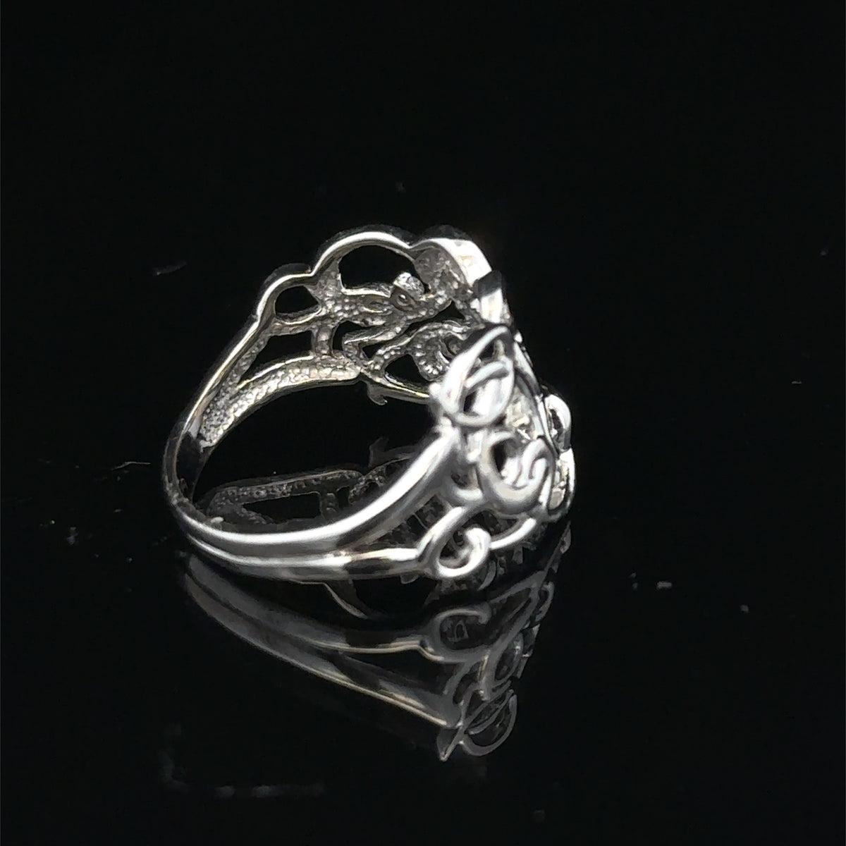9ct white gold diamond ring size K1/2 by Reeves and Sons, featuring a sparkling diamond centerpiece and elegant design.
