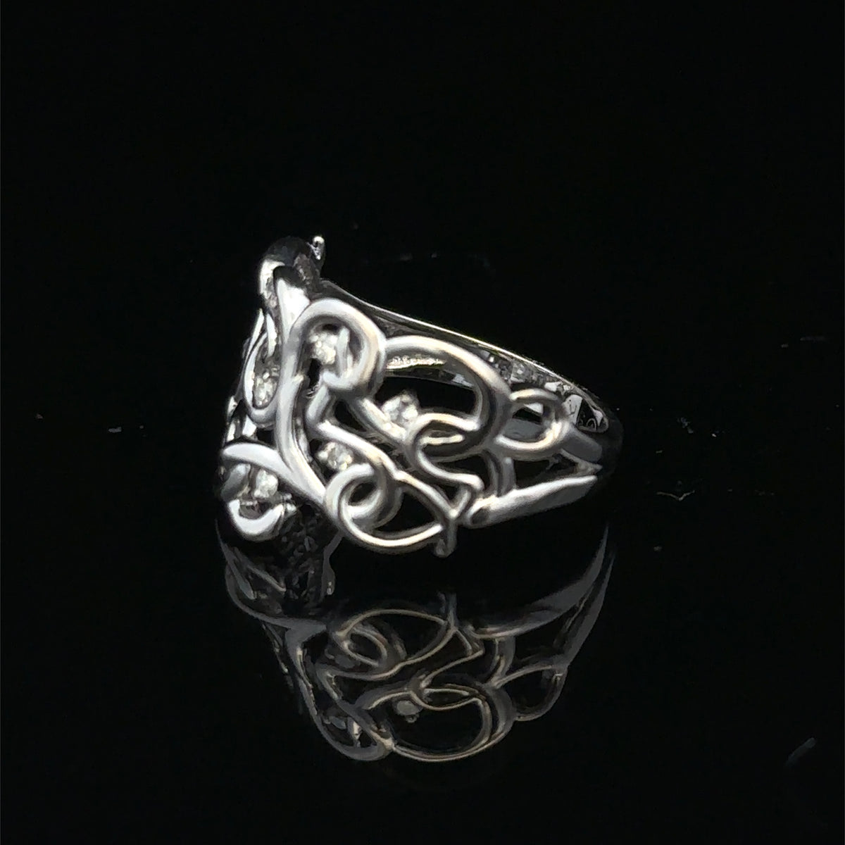 9ct white gold diamond ring in size K1/2 featuring sparkling diamonds, crafted by Reeves and Sons.
