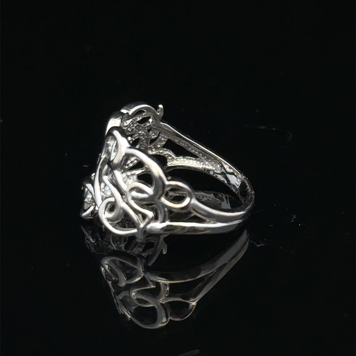 9ct white gold diamond ring with sparkling stones, size K1/2, from Reeves and Sons, showcasing elegant craftsmanship and design.