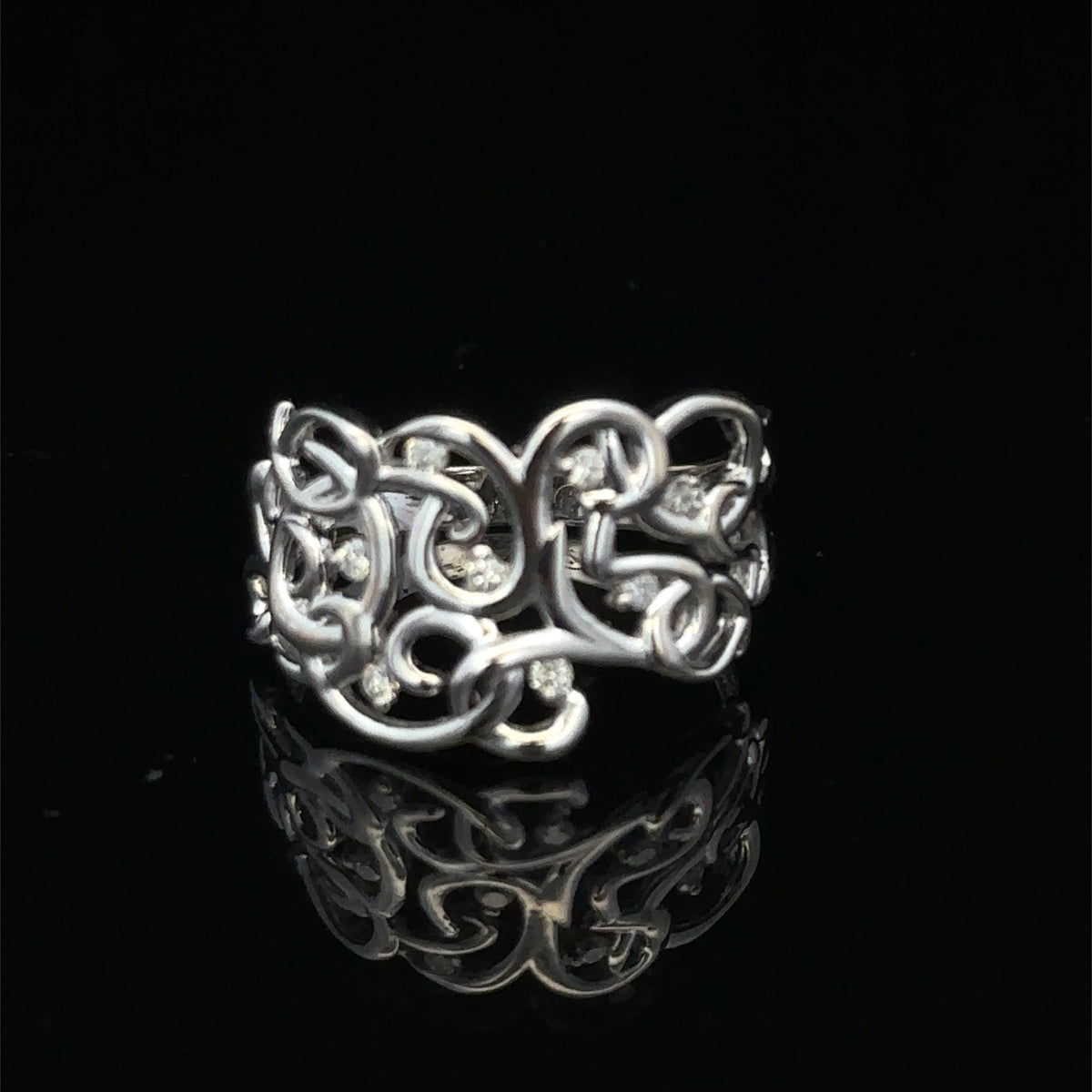 9ct white gold diamond ring in size K1/2 by Reeves and Sons, featuring a sparkling diamond design.