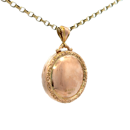 Reeves and Sons 9ct yellow gold locket pendant, 7.5g, featuring intricate design and polished finish, hanging on a chain.