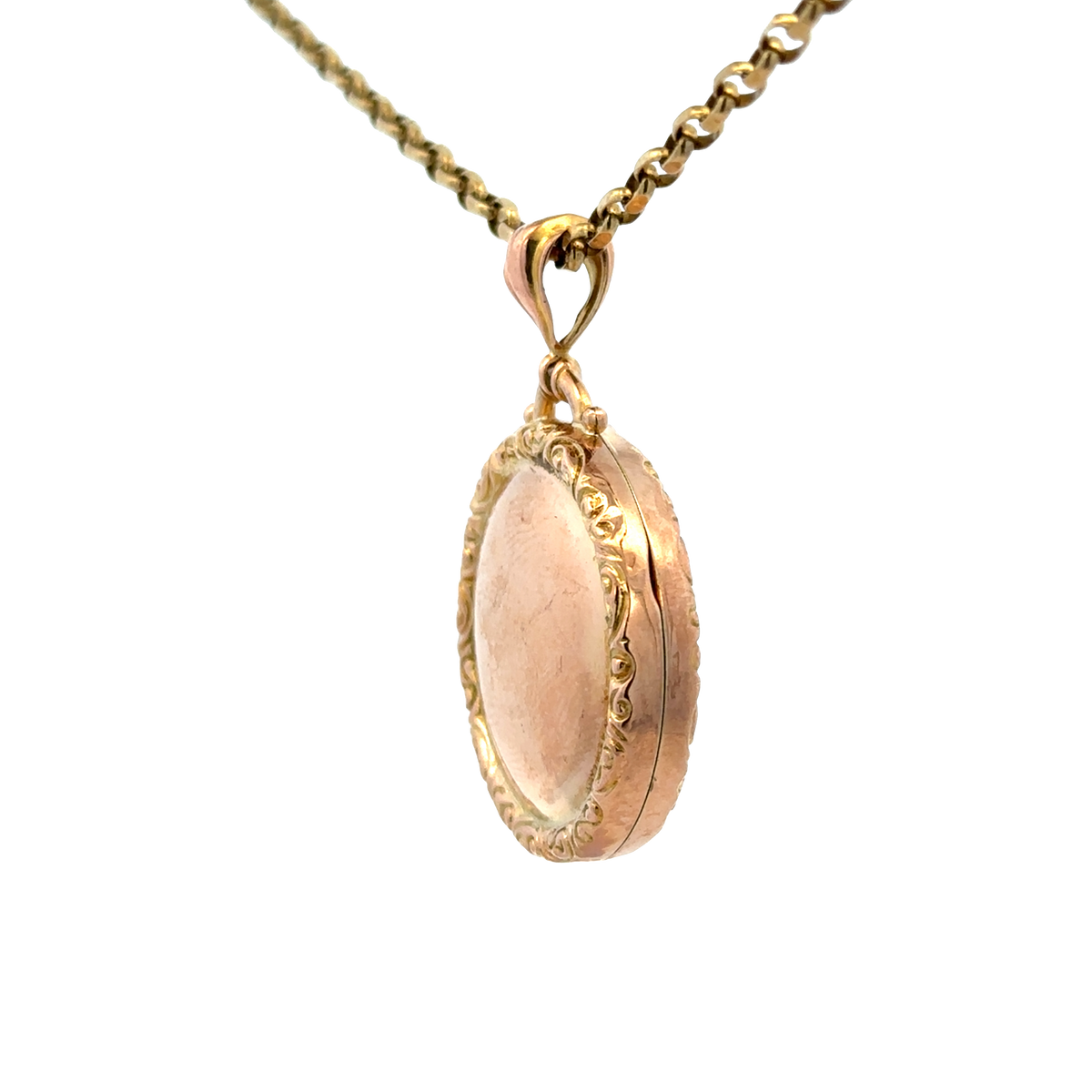 Reeves and Sons 9ct yellow gold locket pendant, 7.5g, featuring intricate engraved design and a polished finish.
