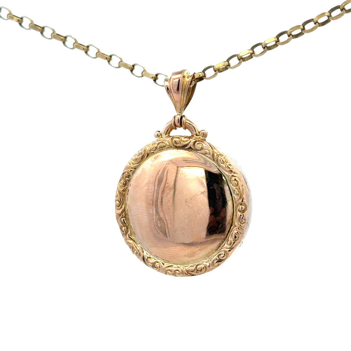 Reeves and Sons 9ct yellow gold locket pendant, 7.5g, featuring intricate design and polished finish, close-up view of the pendant.