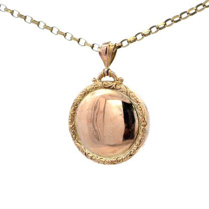 Reeves and Sons 9ct yellow gold locket pendant, 7.5g, featuring intricate design and polished finish, close-up view of the pendant.