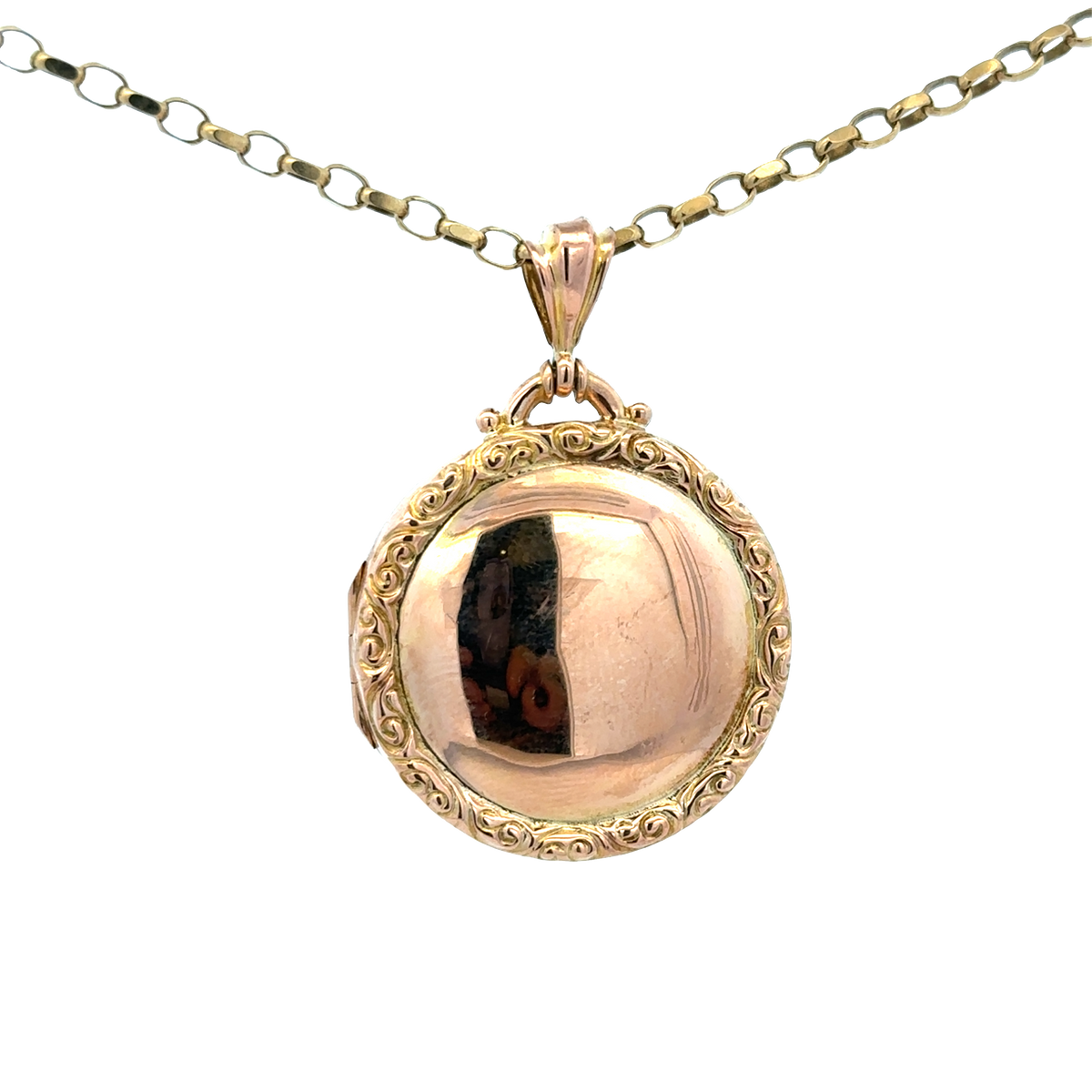Reeves and Sons 9ct yellow gold locket pendant, 7.5g, featuring a smooth oval design with intricate detailing on the front.