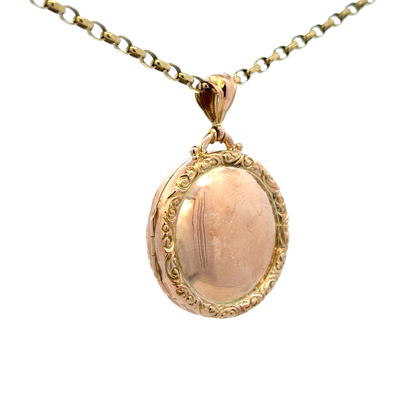 Reeves and Sons 9ct yellow gold locket pendant, 7.5g, showcasing a polished, classic design with a smooth surface and detailed craftsmanship.