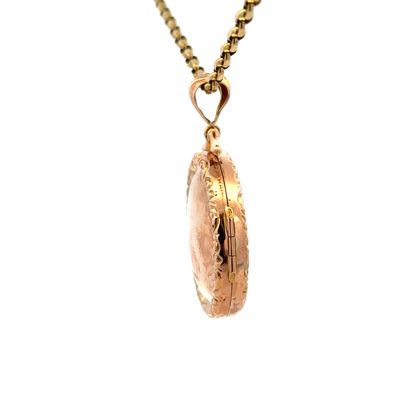 9ct yellow gold locket pendant from Reeves and Sons, showcasing a detailed, polished jewelry piece with a secure hinge clasp.