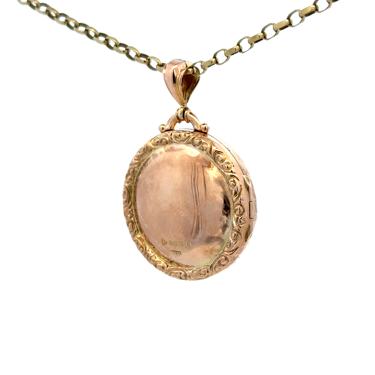9ct yellow gold locket pendant by Reeves and Sons, featuring a polished surface and delicate design, weighs 7.5 grams.