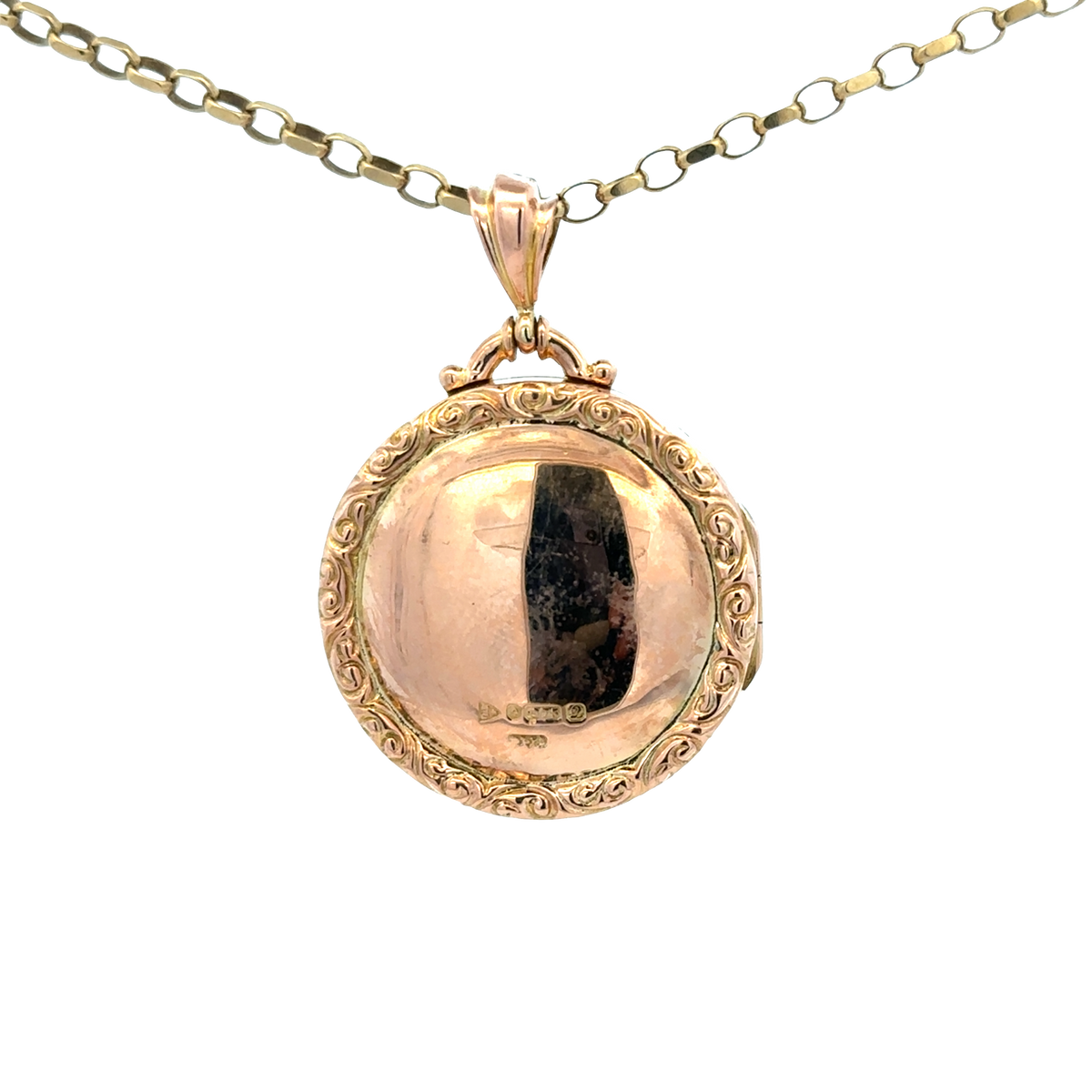 9ct yellow gold locket pendant with intricate design, weight 7.5g, by Reeves and Sons, displayed against a neutral background.