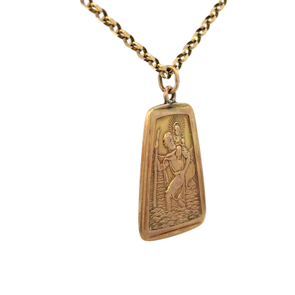 9ct yellow gold St Christopher pendant from Reeves and Sons, featuring detailed religious iconography on a polished gold surface.