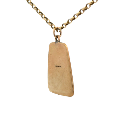 9ct yellow gold St Christopher pendant by Reeves and Sons, showcasing intricate religious design and polished finish.