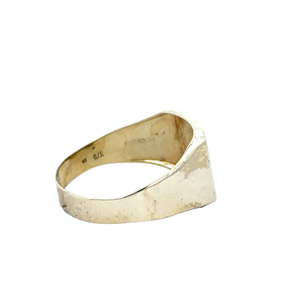 9ct yellow gold signet ring in size X with engraved face, crafted by Reeves and Sons, shown in a close-up image.