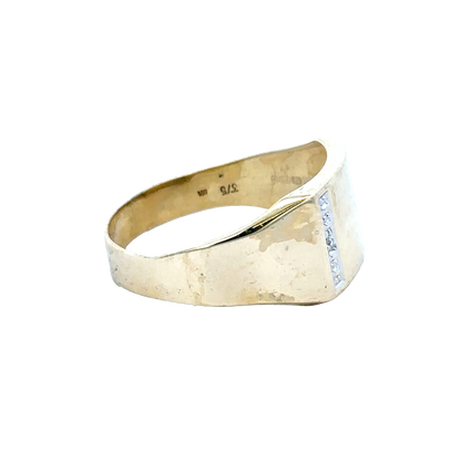 9ct yellow gold signet ring in size X by Reeves and Sons, featuring a polished gold surface and classic design.