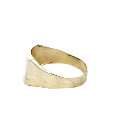 9ct yellow gold signet ring in size X by Reeves and Sons, featuring a polished smooth surface and classic rectangular face.