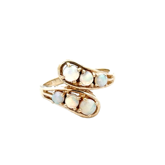 9ct yellow gold ring in size M, sleek and polished, by Reeves and Sons, featuring a smooth band and elegant design.