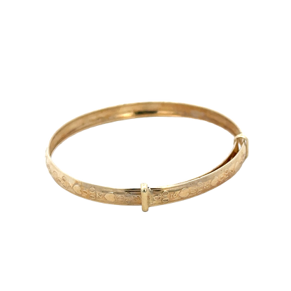 9ct yellow gold baby bangle weighing 2g, showcasing smooth, polished surface and delicate design from Reeves and Sons.