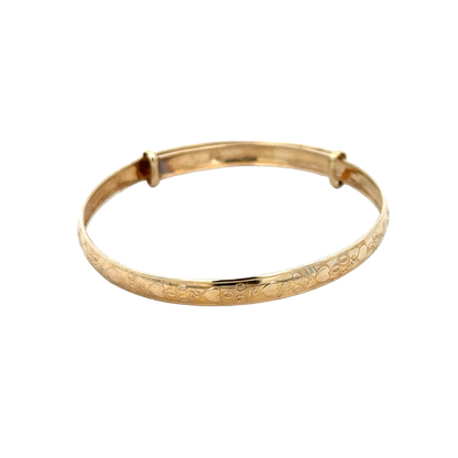 9ct yellow gold baby bangle weighing 2g with smooth, polished finish, showcasing a delicate and elegant design.