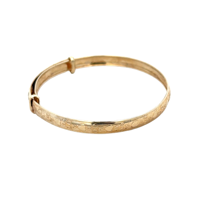 9ct yellow gold baby bangle by Reeves and Sons, showcasing a delicate and shiny 2g jewelry piece for infants.