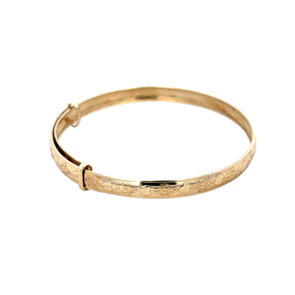 9ct yellow gold baby bangle weighing 2g, elegant and simple jewelry piece from Reeves and Sons, displayed on a white background.