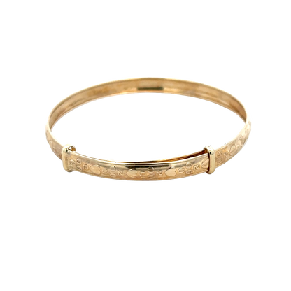 9ct yellow gold baby bangle weighing 2g, designed by Reeves and Sons, featuring a smooth, polished finish.