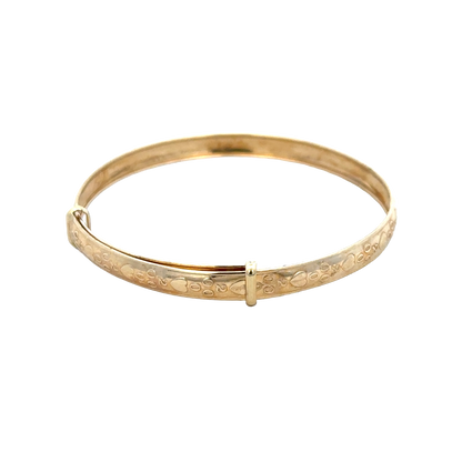 9ct yellow gold baby bangle with a smooth, polished finish, weighing 2g, from Reeves and Sons.