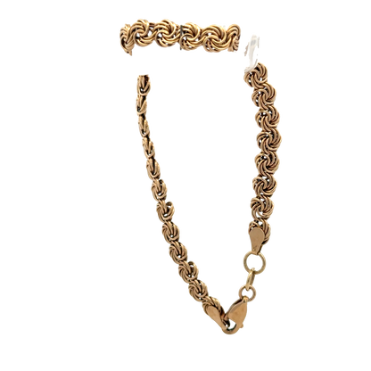 9ct yellow gold bracelet weighing 4.8g from Reeves and Sons, featuring a sleek, polished design with a secure clasp.
