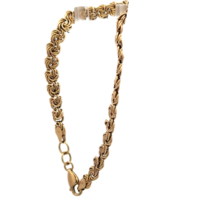 Reeves and Sons 9ct yellow gold bracelet weighing 4.8g, featuring a delicate chain design and polished finish.